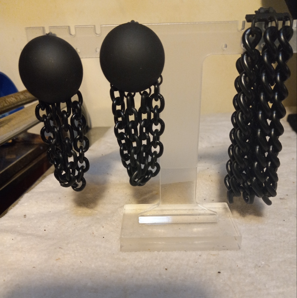 Not new, never worn 2pc black 3 chain bracelet & matching clip earrings.